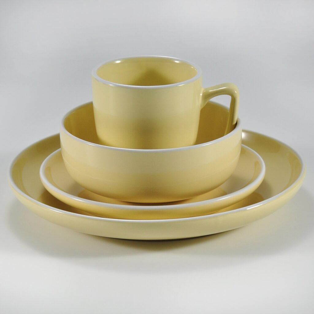 16-piece glossy yellow rimmed stoneware dinner set by Xuye Ceramics