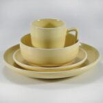 16-piece glossy yellow rimmed stoneware dinner set by Xuye Ceramics