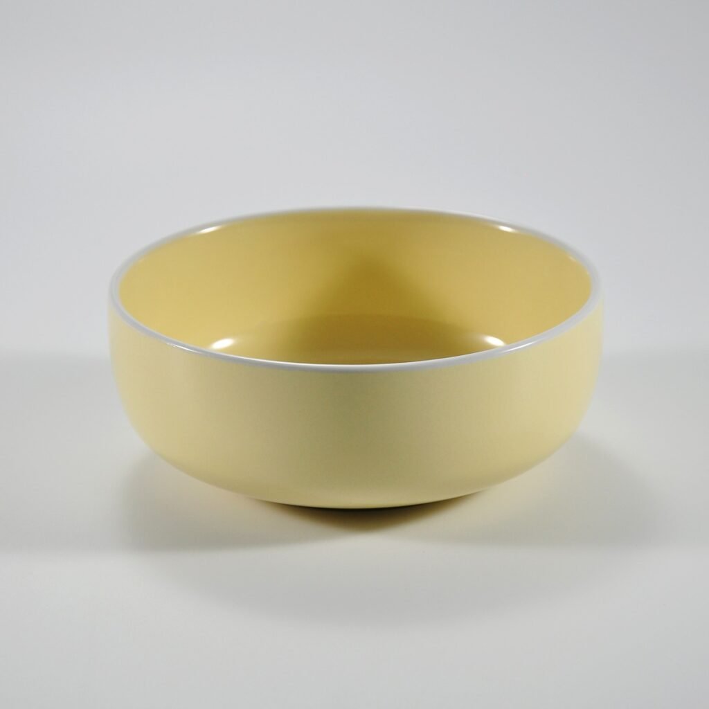 16-piece glossy yellow rimmed stoneware dinner set by Xuye Ceramics