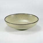 16-piece matte khaki speckled stoneware dinner set by Xuye Ceramics