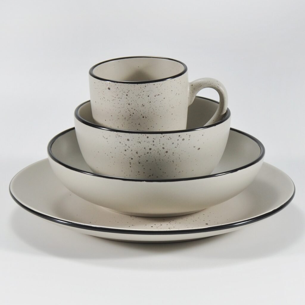 16-piece matte cream speckled stoneware dinner set by Xuye Ceramics
