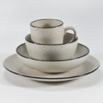 16-piece matte cream speckled stoneware dinner set by Xuye Ceramics