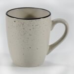 16-piece matte cream speckled stoneware dinner set by Xuye Ceramics