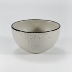 16-piece matte cream speckled stoneware dinner set by Xuye Ceramics