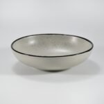 16-piece matte cream speckled stoneware dinner set by Xuye Ceramics