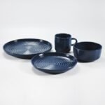 16-piece glossy dark blue embossed stoneware dinner set by Xuye Ceramics
