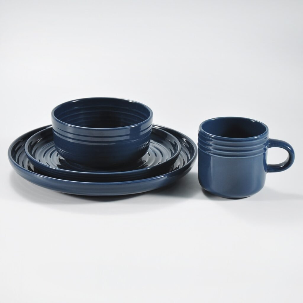 16-piece glossy dark blue embossed stoneware dinner set by Xuye Ceramics