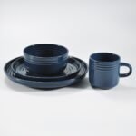 16-piece glossy dark blue embossed stoneware dinner set by Xuye Ceramics