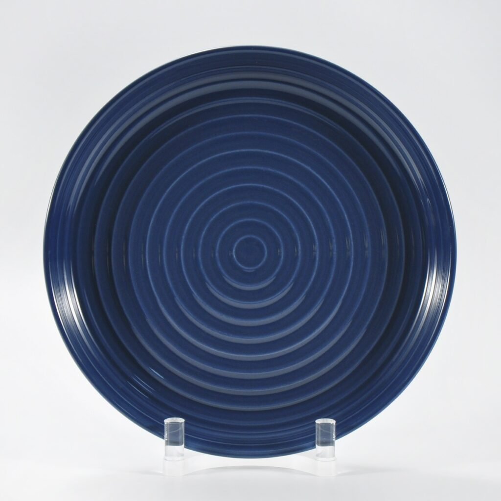 16-piece glossy dark blue embossed stoneware dinner set by Xuye Ceramics