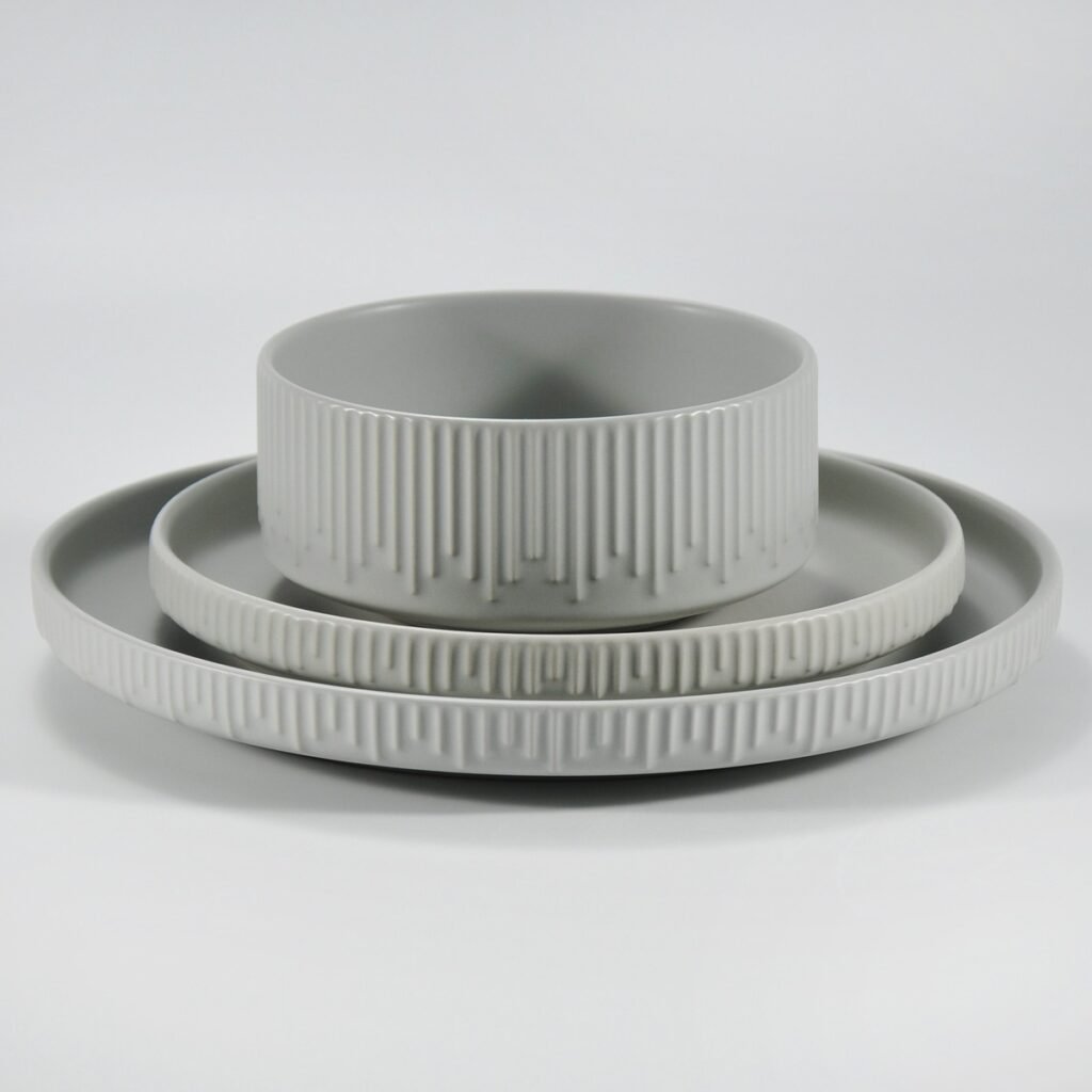 12-piece matte white embossed stoneware dinner set by Xuye Ceramics