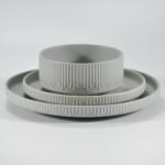 12-piece matte white embossed stoneware dinner set by Xuye Ceramics