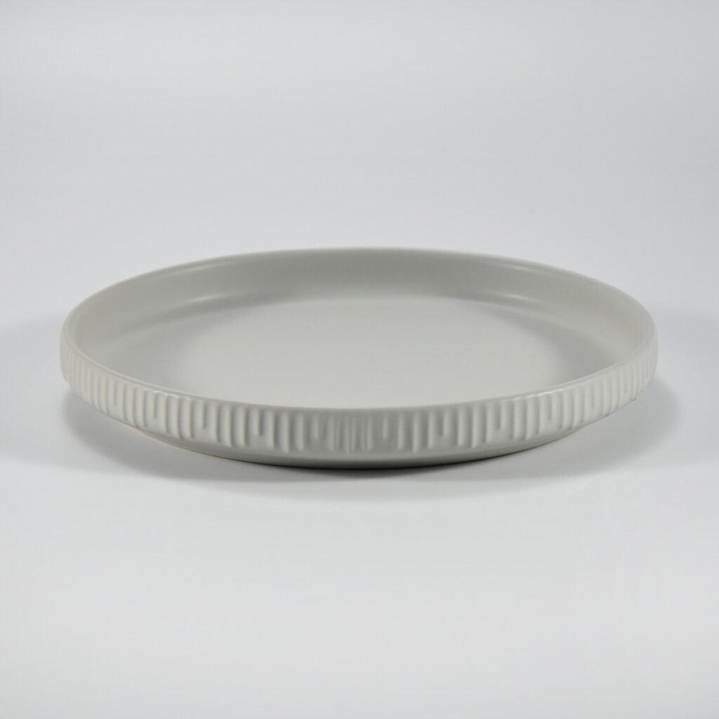 12-piece matte white embossed stoneware dinner set by Xuye Ceramics