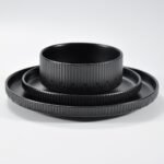 12-piece matte black embossed stoneware dinner set by Xuye Ceramics