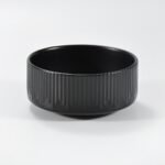12-piece matte black embossed stoneware dinner set by Xuye Ceramics