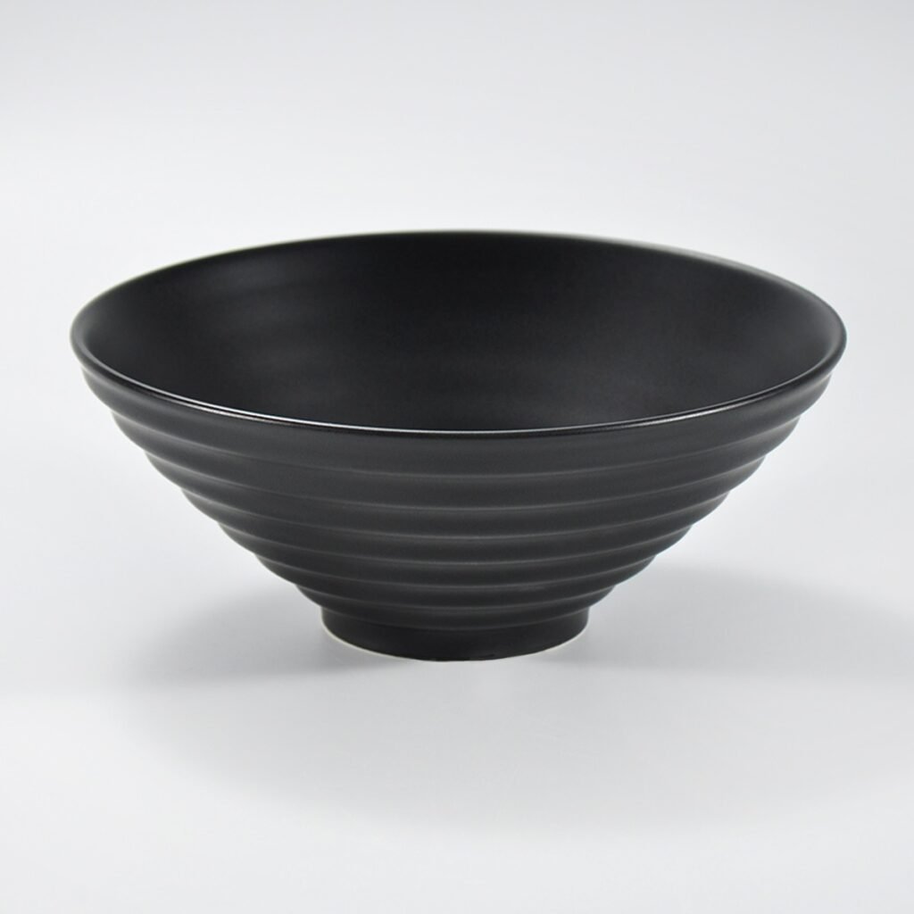 Matte black wide-rim embossed ramen bowl by Xuye Ceramics