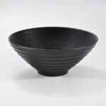 Matte black wide-rim embossed ramen bowl by Xuye Ceramics