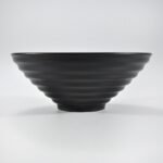 Matte black wide-rim embossed ramen bowl by Xuye Ceramics