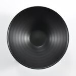 Matte black wide-rim embossed ramen bowl by Xuye Ceramics